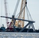 Key Bridge Response 2024 Unified Command salvors move a large piece of supporting steel from the collapsed Francis Scott Key Bridge.